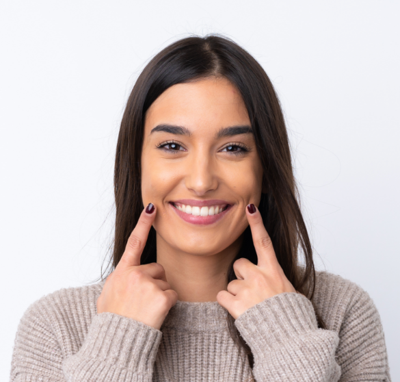 Woman smiling and showing healthy teeth