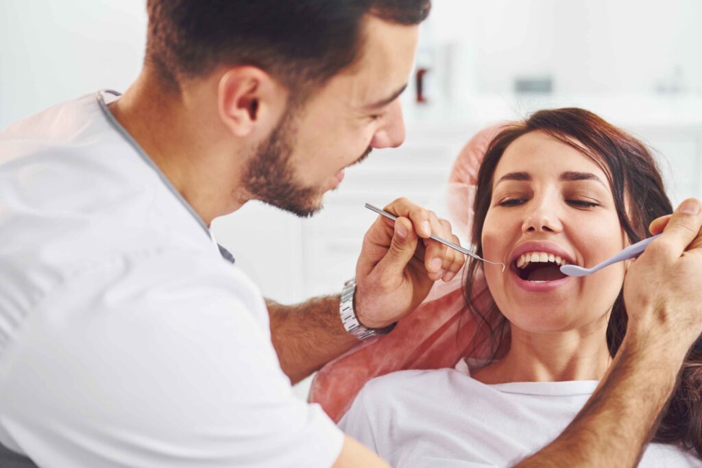 Dentist examining a patient’s teeth